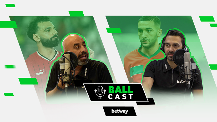 A podcast cover featuring two men wearing headphones and speaking into microphones, with the title Ball Cast by Betway Arabia. Two soccer players are seen in the background, one in a red jersey and the other in an orange jersey, set against a vibrant green backdrop.