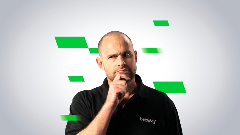 A bald man in a black Betway Arabia polo shirt stands with a thoughtful expression, surrounded by green geometric shapes on a light background.